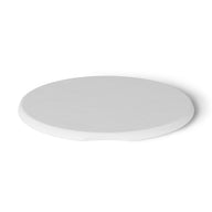 A round, flat, white coaster from Ledge Lounger mimicking the Signature Side Table Lid has a slight indentation on one side and is set against a plain white background.
