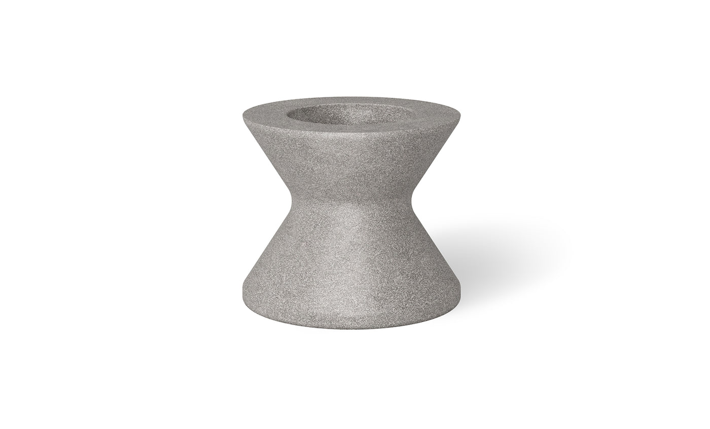 A gray, hourglass-shaped stone stool by Ledge Lounger is displayed on a plain white background. Similar to the Signature Tall Ice Bin Side Table, it has a textured surface with a circular top and bottom and an indented middle, ideal for enhancing your outdoor decor.