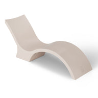 The Ledge Lounger Signature Chaise Deep is a modern cream-colored, S-shaped lounge designed for pool tanning ledges, perfect for relaxation on a white backdrop.
