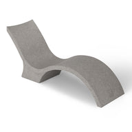 The Signature Chaise Deep by Ledge Lounger is a modern, sculptural chaise lounge perfect for your tanning ledge. It features a smooth gray surface and a wavy, minimalist design with a curved seat and backrest for an elegant silhouette ideal for sun relaxation.