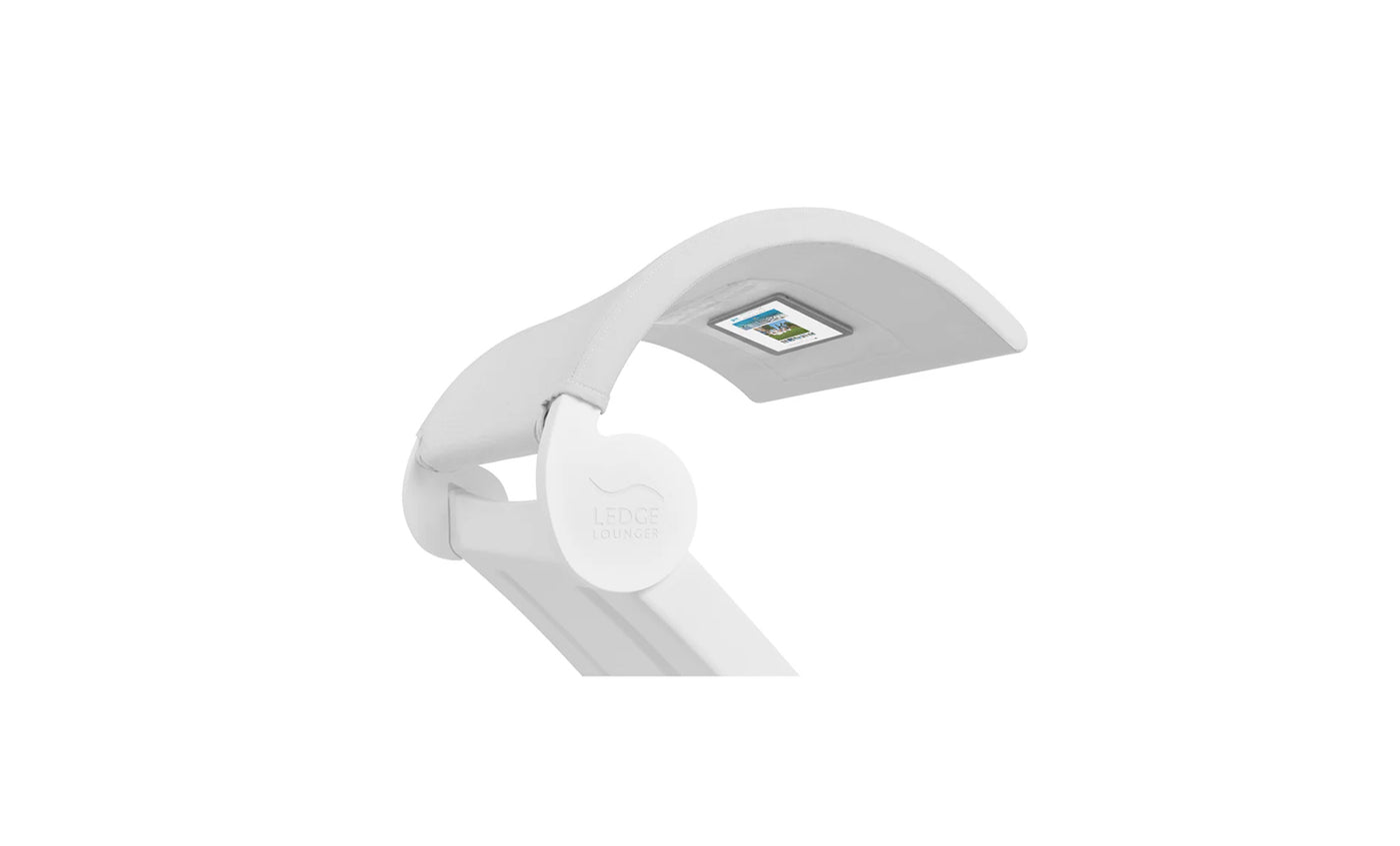 The Signature Chaise Shade by Ledge Lounger is a modern, white desk lamp with an adjustable arm that enhances your media viewing. It features a curved rectangular light head with a digital display and Ledge Lounger proudly displayed on the hinge against a plain white background.