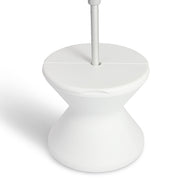 The Signature Tall Ice Bin Side Table by Ledge Lounger is a modern, white, hourglass-shaped stand with a flat top and sleek design. Its minimalistic style features smooth curves and a clean finish, making it both functional and stylish.