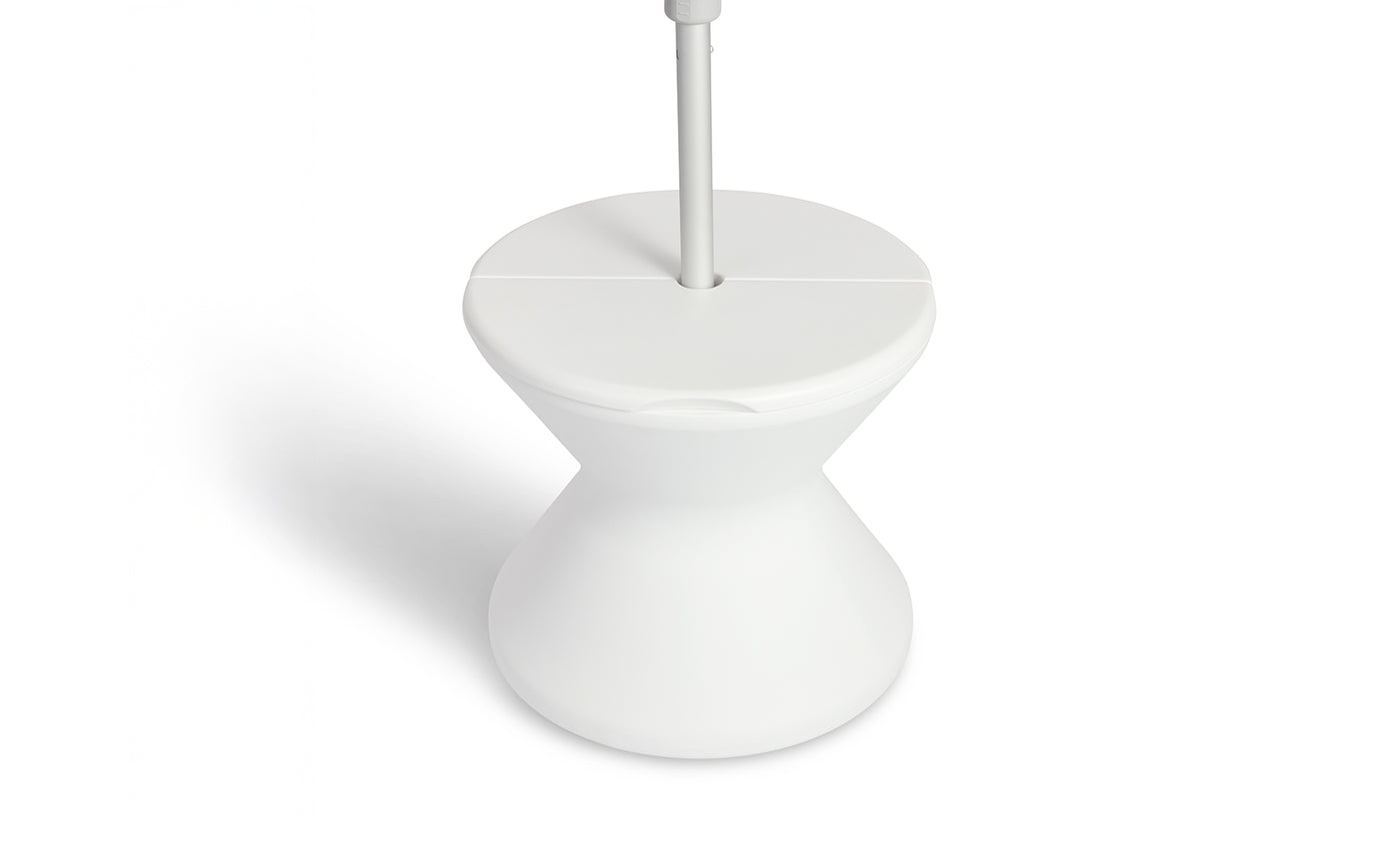 The Signature Tall Ice Bin Side Table by Ledge Lounger is a modern, white, hourglass-shaped stand with a flat top and sleek design. Its minimalistic style features smooth curves and a clean finish, making it both functional and stylish.