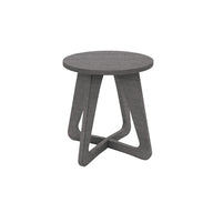 Introducing the Mainstay Stool by Ledge Lounger: a sleek grey wooden stool with a round seat and modern geometric base featuring triangular leg designs. Ideal for patios, it seamlessly enhances any outdoor space with its contemporary style.