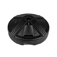 The Ledge Lounger Resin Coated Concrete Umbrella Base is a round black plastic item with a textured design and central hole for center pole umbrellas, featuring geometric patterns that enhance your outdoor dining experience.