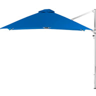 The Ledge Lounger Ultra Cantilever Umbrella features a blue 10 square canopy with a white pole and adjustable arm on the right. Its modern triangular design is enhanced by a rechargeable light, creating a gentle ambiance for your outdoor space.