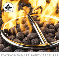 The Halo Aglow Bundle by Ledge Lounger features a circular gas fire pit with flames dancing over black lava rocks and a stainless steel burner ring. In the top left corner, it displays a certification logo. The bottom text highlights State-of-the-art safety features.