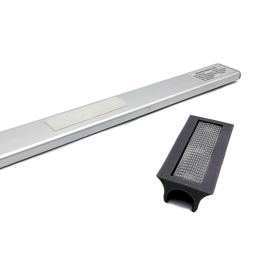 The Umbrella Light by Ledge Lounger includes a sleek silver bar with textured detail, paired with a rechargeable black rectangular attachment featuring a grid pattern. It fits seamlessly onto the bar to enhance your patio, all set against a plain white background.