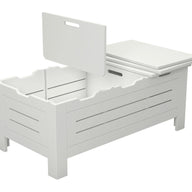 The Ledge Lounger Mainstay Storage Coffee Table is a white wooden box with internal compartments and a partially open slatted lid with a handle. Serving as chic storage, it elegantly stands on four legs.