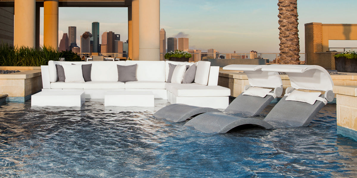 Ledge In-pool furniture sectional and two Signature Chaises with pillows and shades