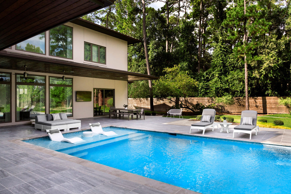 Outdoor space with a pool and furniture