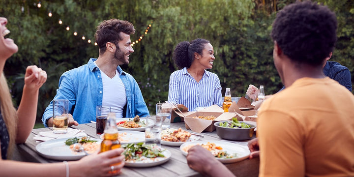 Celebrating dinner together at a BBQ event