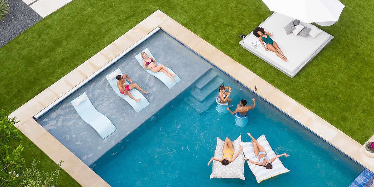 Friends hanging out in the pool