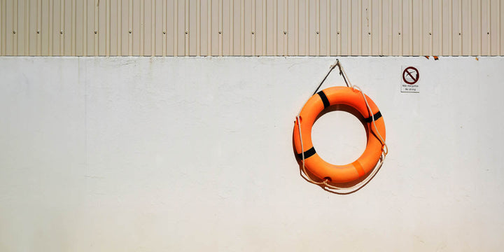 Wall with orange lifesaver hanging