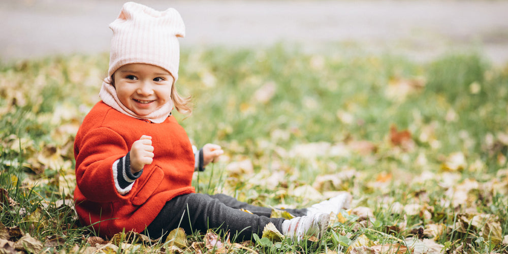 Kid sitting on the lawn