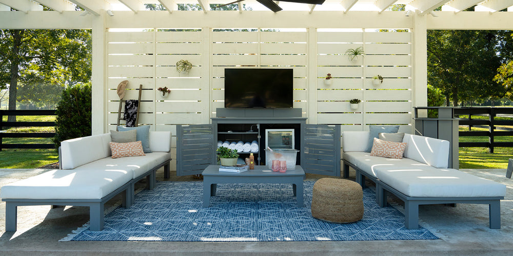 Outdoor living space with mainstay bar credenza and mainstay sectionals from Ledge