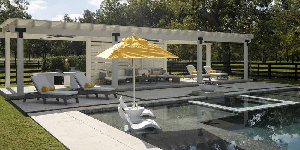 Pool in a backyard oasis with in-pool furniture