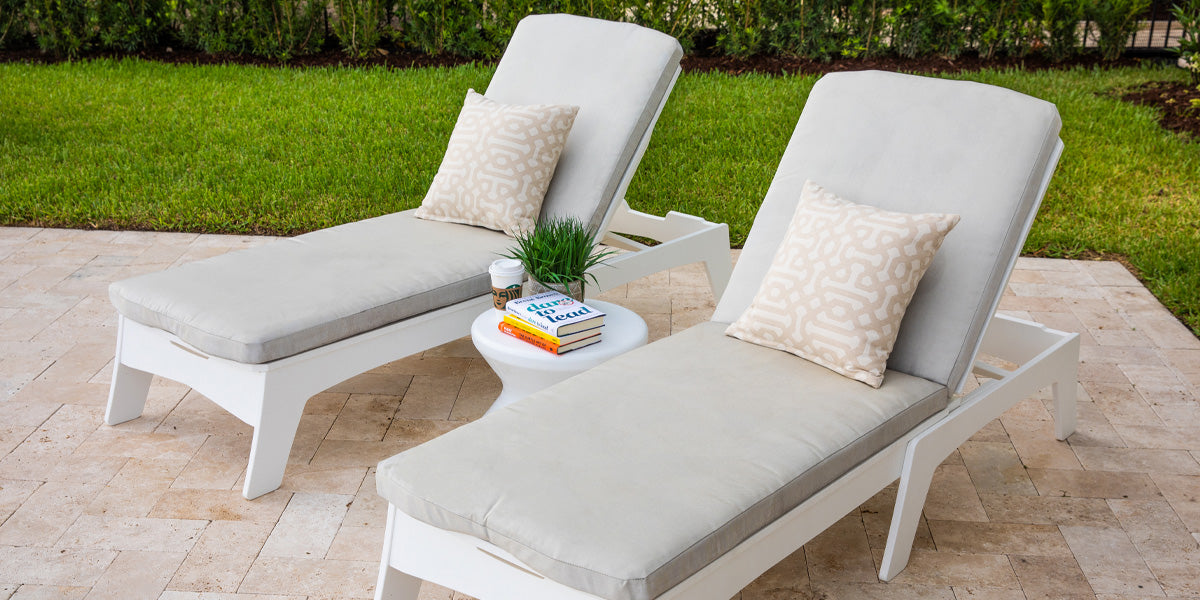 Two outdoor chaise loungers on the patio