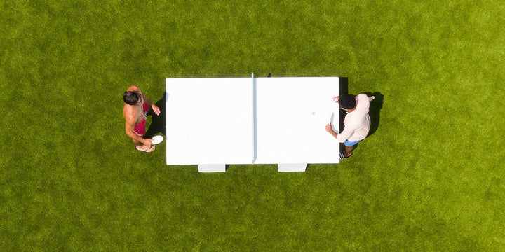 Guys playing ping pong outside