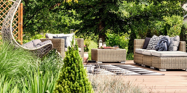 Garden with beautiful outdoor furniture for relaxing
