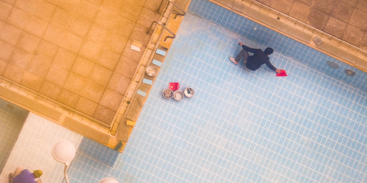Doing work on a pool ledge