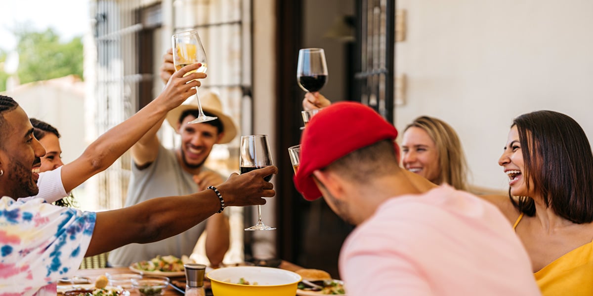 Friends cheering with wine glasses