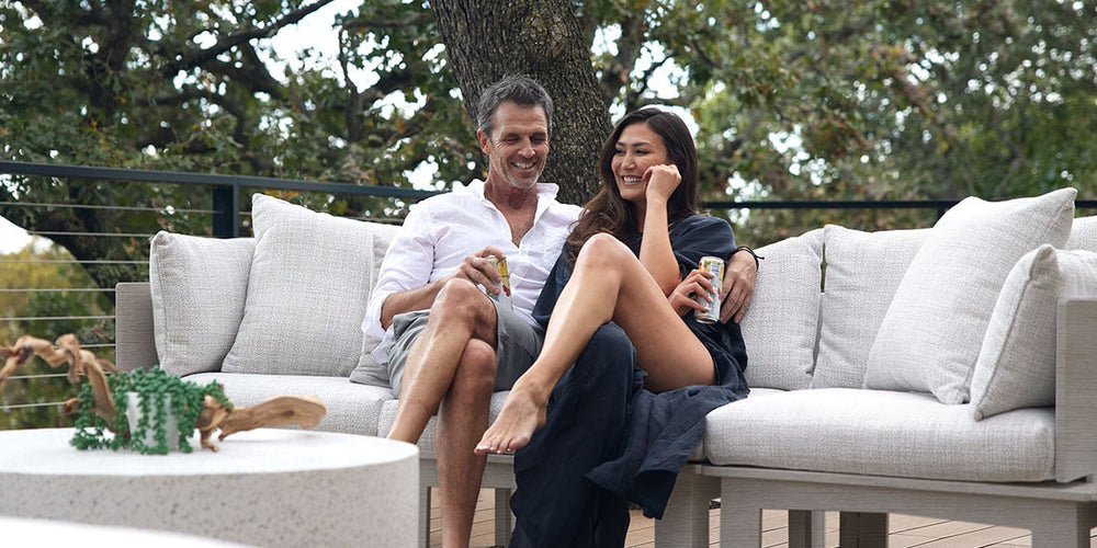Couple sitting on outdoor sectional