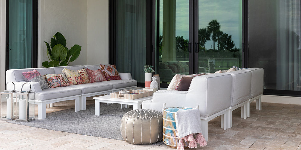 Outdoor living space with two sofas and a coffee table