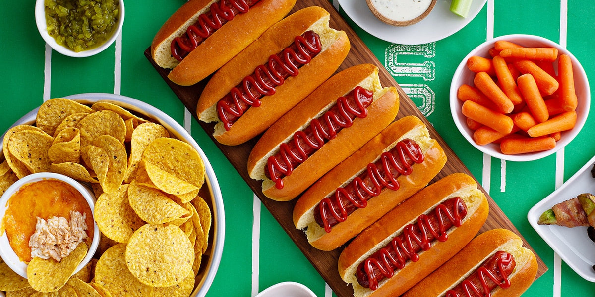 Hot dog, potato chips, and other tailgating foods