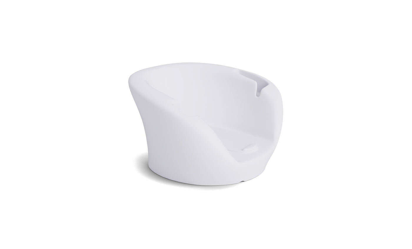 The Ledge Lounger Autograph Chaise Armrest Console is a modern white armchair with a smooth, minimalist design and integrated console, shown against a plain white background with a soft shadow.