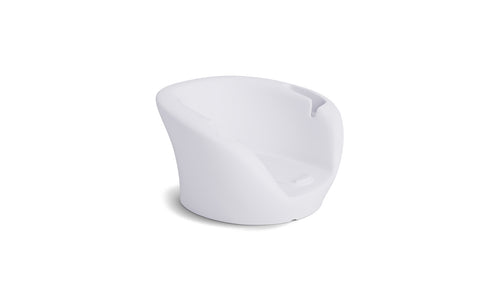 The Ledge Lounger Autograph Chaise Armrest Console is a modern white armchair with a smooth, minimalist design and integrated console, shown against a plain white background with a soft shadow.