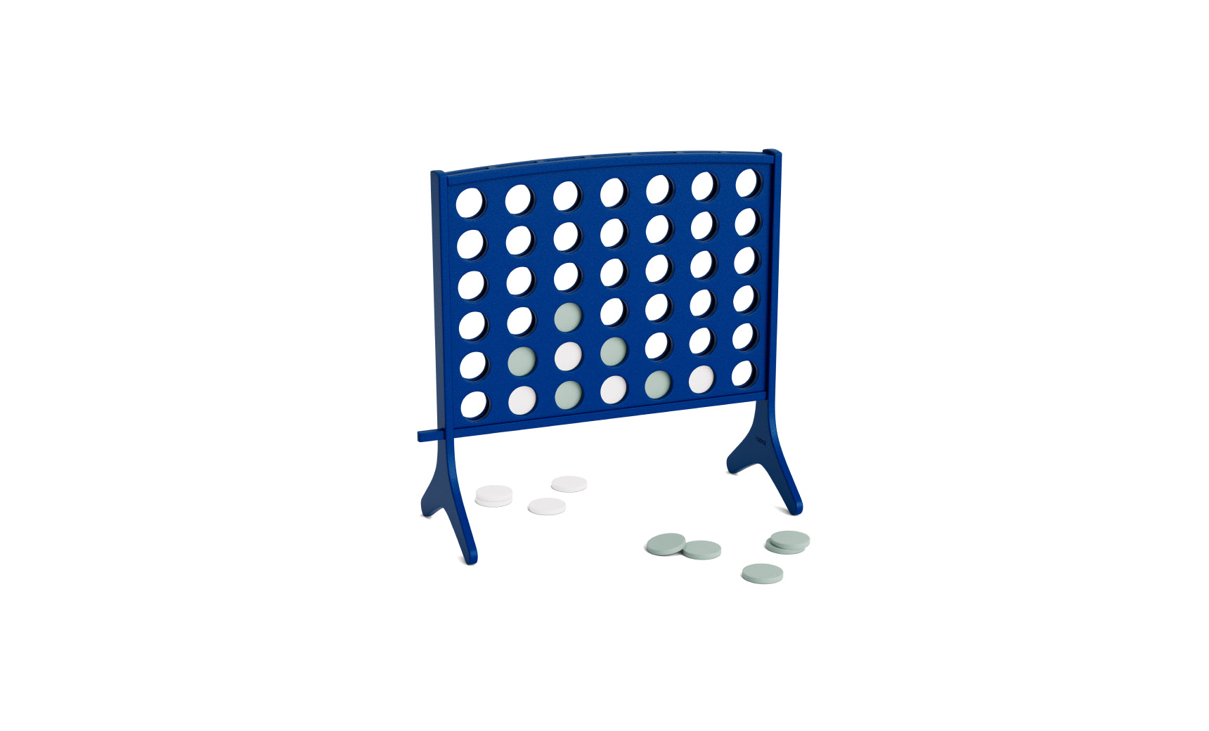 A blue Ledge Lounger Four In A Row game grid stands upright, with several white and gray playing discs scattered across the white surface around it, showcasing this oversized four in a row as a fun and impressive giant outdoor game.