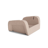 A light brown, rectangular molded pulp insert with raised sides and open center, designed to securely hold the Ledge Lounger Signature Chaise Armrest Console during shipping. Background is plain white.