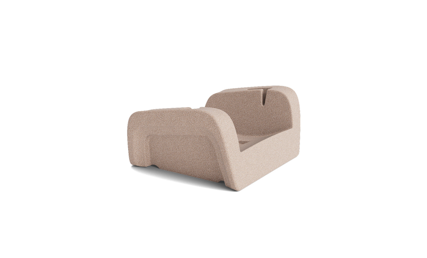 A light brown, rectangular molded pulp insert with raised sides and open center, designed to securely hold the Ledge Lounger Signature Chaise Armrest Console during shipping. Background is plain white.