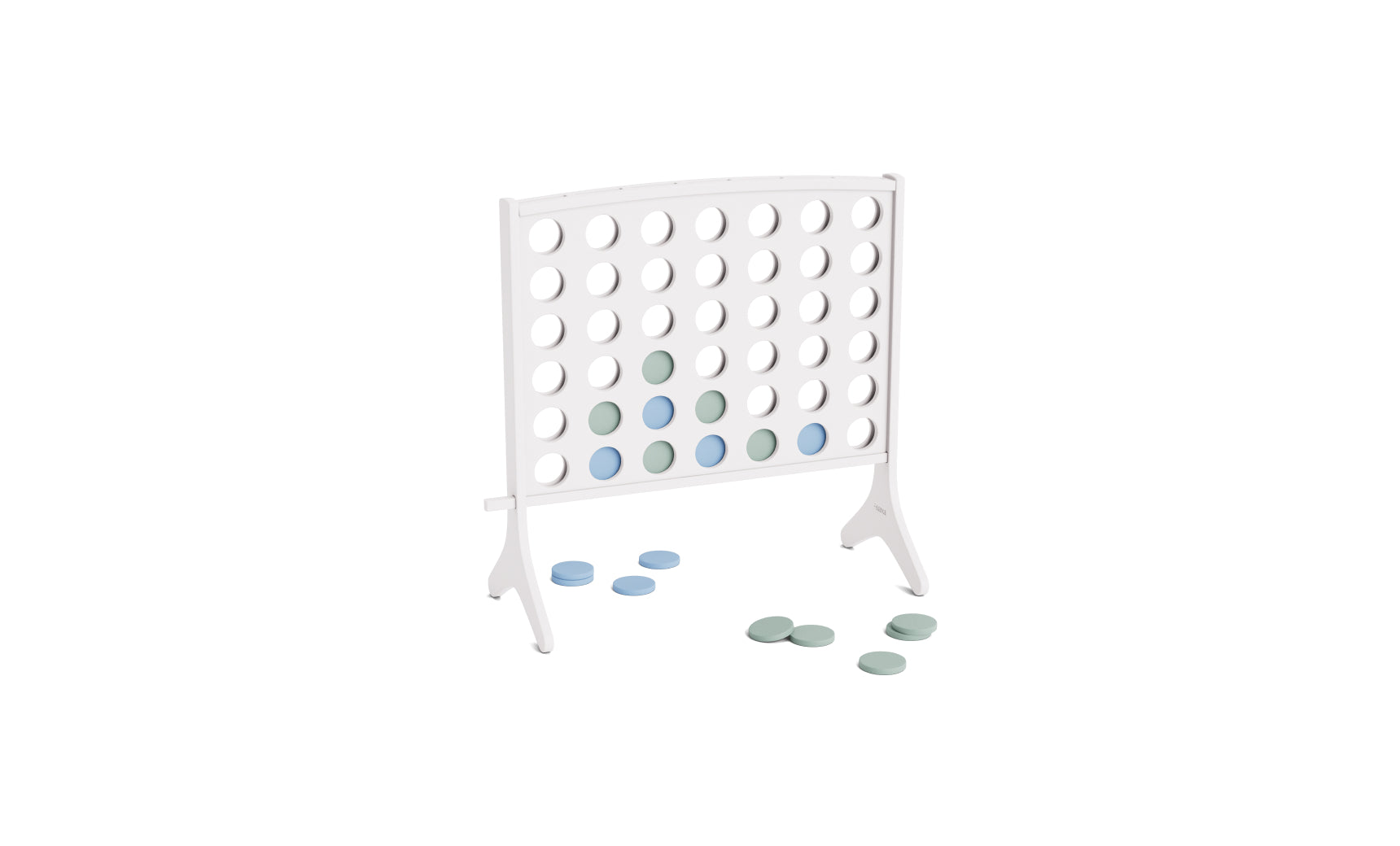 The Ledge Lounger Four In A Row is a white vertical game board with alternating light blue and green discs placed inside, and several discs resting on the nearby surface. This oversized outdoor game features an all-weather design, making it the perfect giant Four In A Row experience for backyard gatherings.