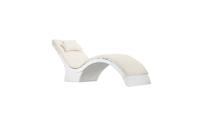 The Signature Chaise Deep Cushion by Ledge Lounger offers a modern design with a white curved frame, soft beige upholstery, and smooth arc for comfortable reclining. It includes a matching headrest and is set against a plain white background. Final Sale.