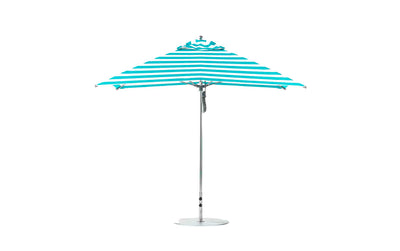 The Ledge Lounger Essential Fiberglass Umbrella - 10 Square Pulley features blue and white stripes standing upright on a sturdy metal stand, crafted with marine-grade fabrics that ensure durability.