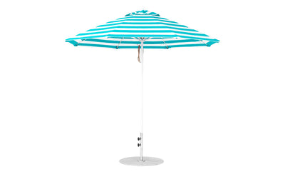 The Ledge Lounger Essential Fiberglass Umbrella, with a blue and white striped 9 octagon canopy, straight pole, and circular base, offers ample shade. Its crafted with marine-grade fabrics for outdoor durability.