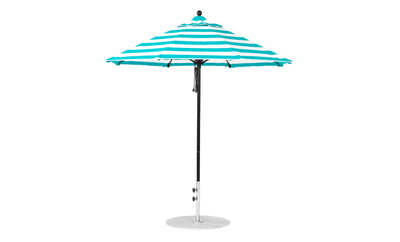 The Essential Fiberglass Umbrella by Ledge Lounger features a teal and white striped marine-grade fabric canopy atop a black pole with a silver base. This wind-resistant 7.5 octagon pulley umbrella is shown fully open against a plain white background.