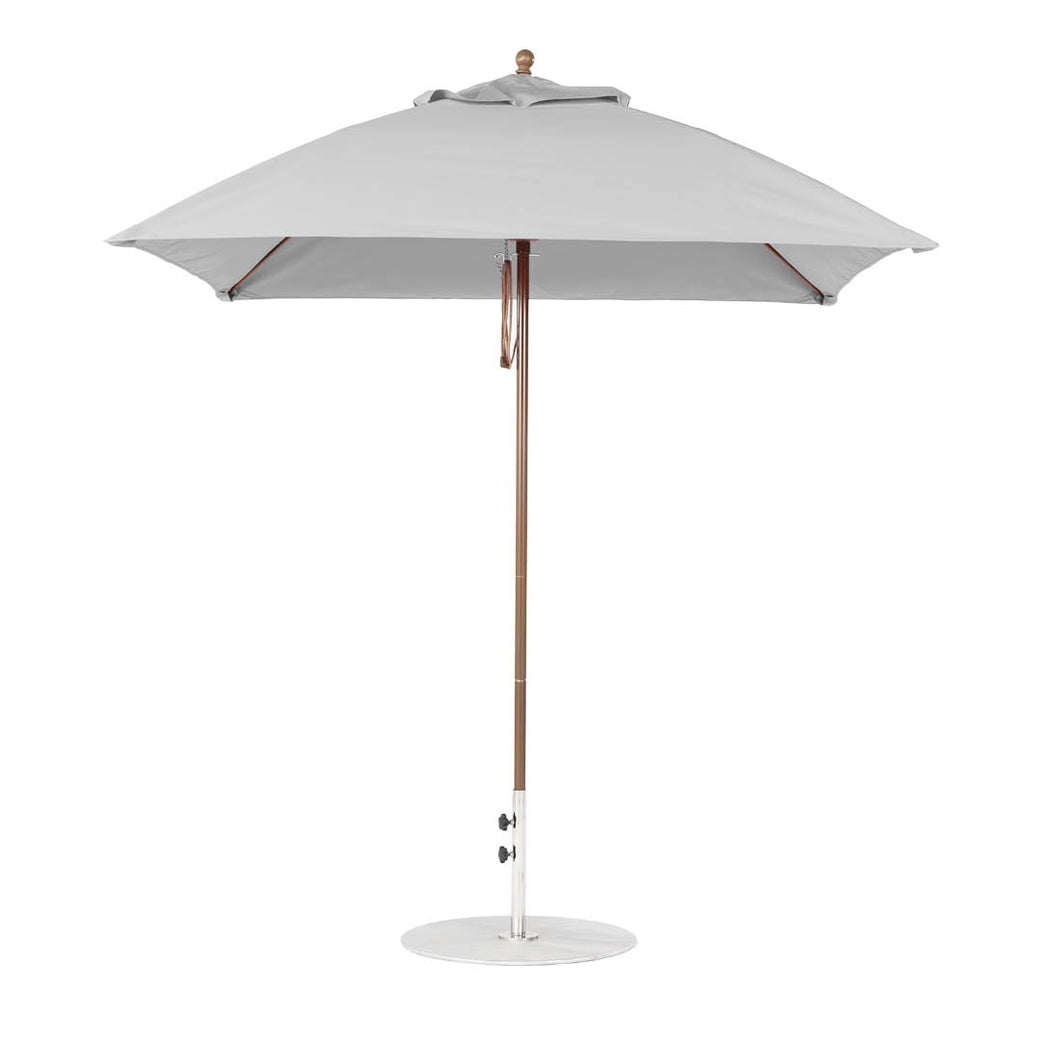 The Ledge Lounger Essential Fiberglass Umbrella - 7.5 Square Pulley, made with marine-grade fabric, features a wooden pole and metal base. Set against a white background, its gray design highlights its simplicity and sturdiness when fully open.