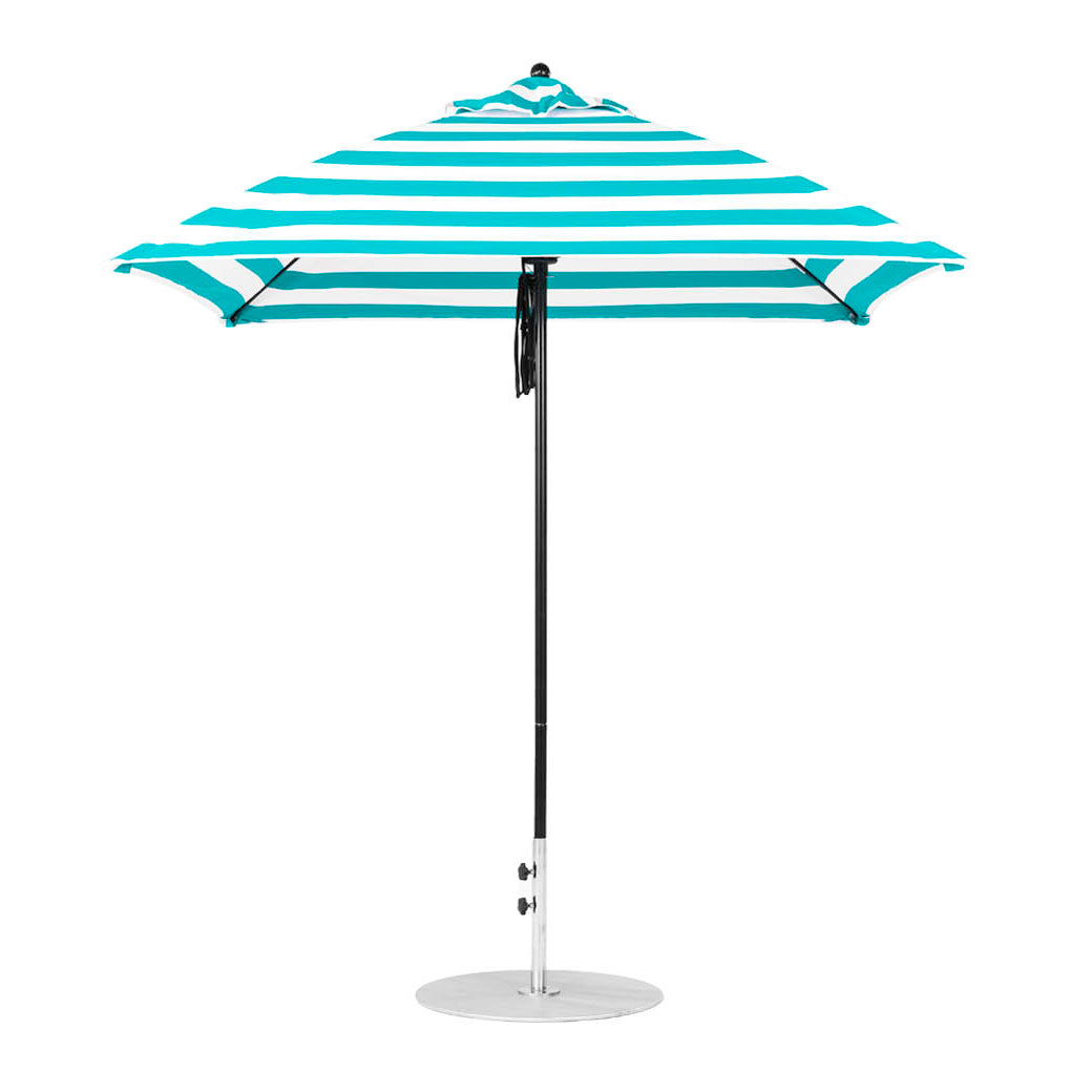 The Ledge Lounger Essential Fiberglass Umbrella, a 7.5 square pulley model in blue and white stripes, with a slim metal pole and round base, stands upright against a pristine white background.