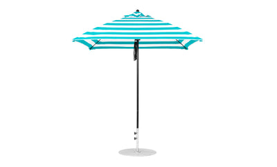 The Ledge Lounger Essential Fiberglass Umbrella, a 7.5 square pulley model in blue and white stripes, with a slim metal pole and round base, stands upright against a pristine white background.