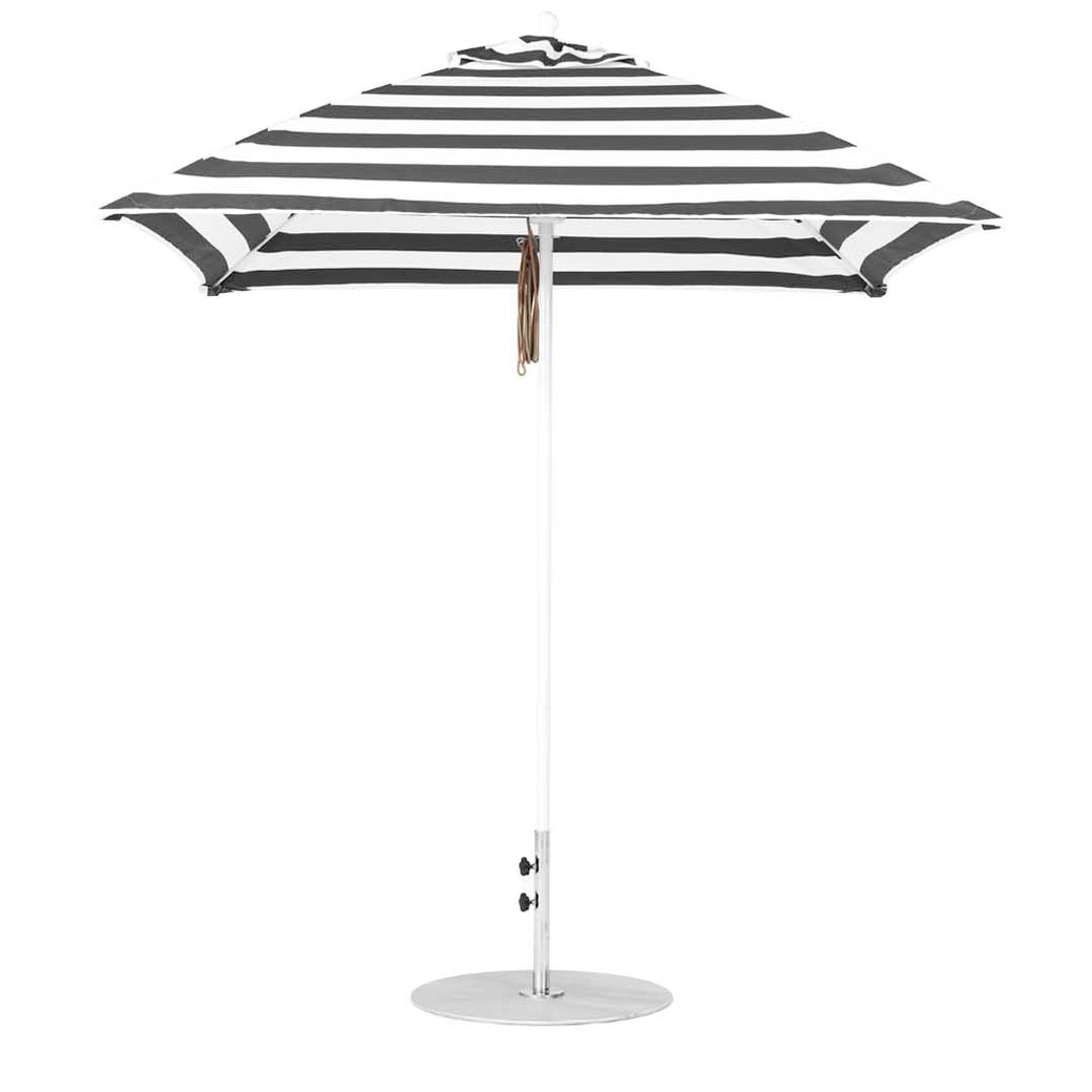 The Essential Fiberglass Umbrella by Ledge Lounger features a striped black and white design with a round base, central metallic pole, and wooden handle. Crafted for durability and style from marine-grade fabrics, its circular canopy is fully open against a white background.