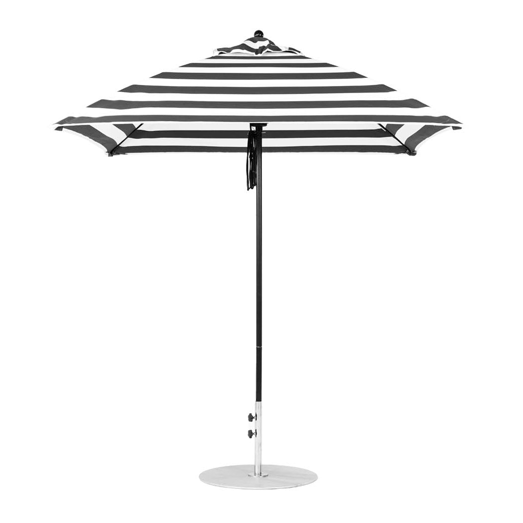 The Ledge Lounger Essential Fiberglass Umbrella, with a 7.5 square pulley, offers a classic black and white striped design. Crafted from marine-grade fabrics, it includes a straight pole and pointed top for outdoor elegance and durability.