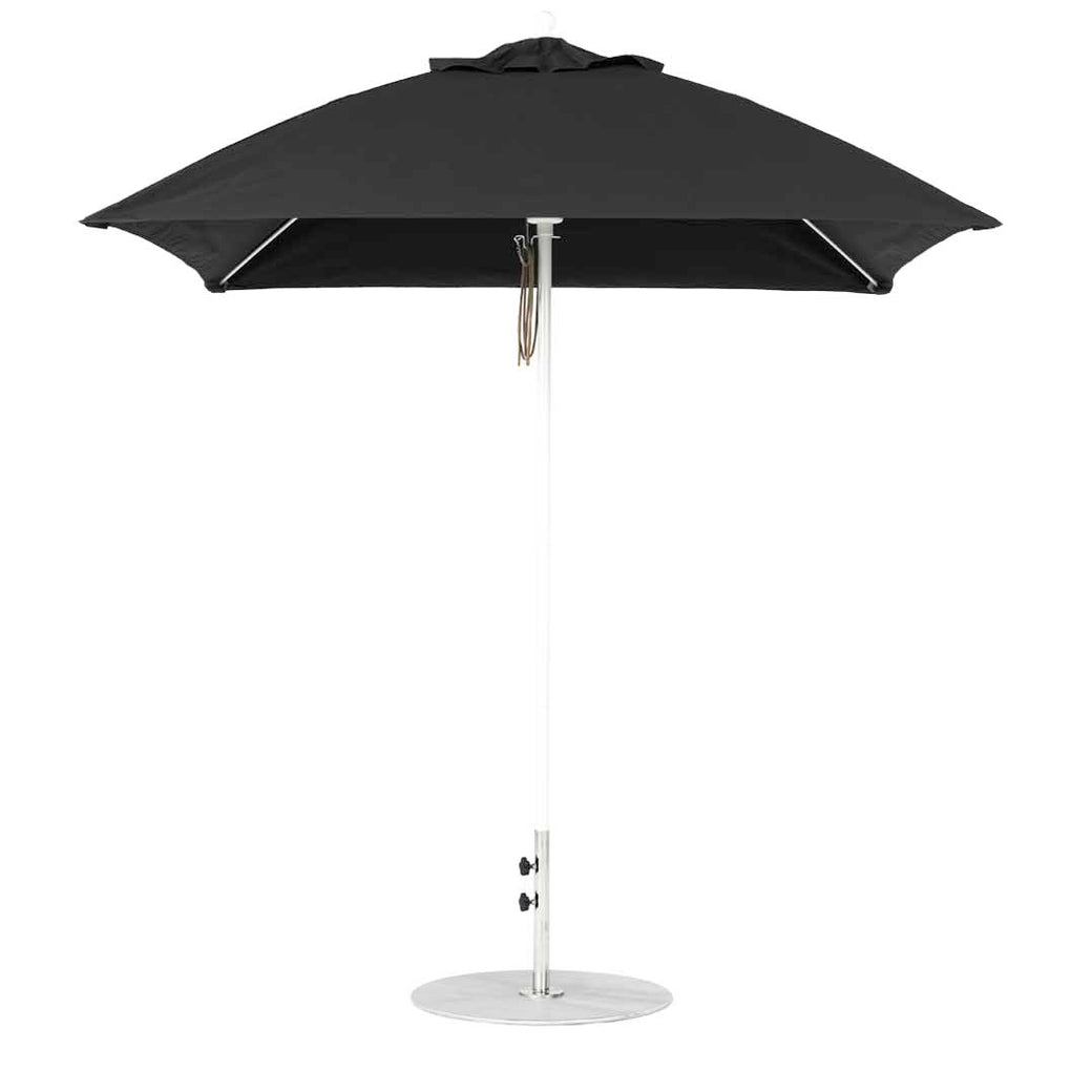 The Ledge Lounger Essential Fiberglass Umbrella - 7.5 Square Pulley features a minimalist black hexagonal canopy made from marine-grade fabric, a silver pole, and a round metal base, offering durability and chic style for outdoor settings.