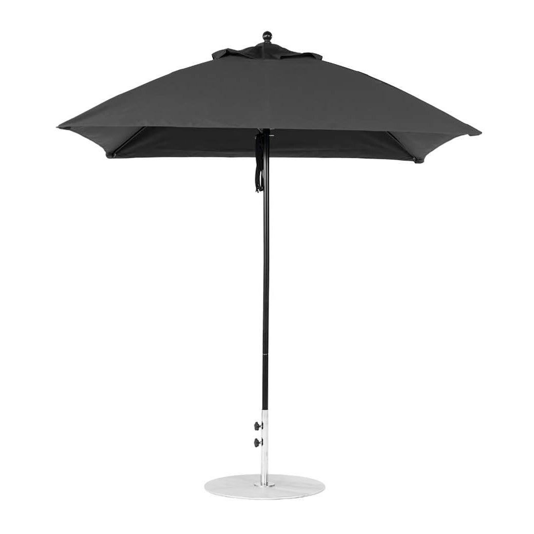 The Ledge Lounger Essential Fiberglass Umbrella features a 7.5 square canopy made from marine-grade fabric, with a sleek black design and silver pole, standing on a circular metal base against a pristine white background.