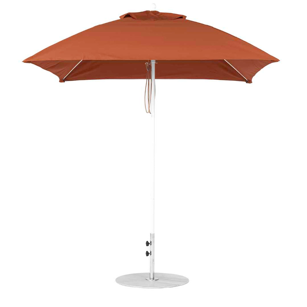 The Ledge Lounger Essential Fiberglass Umbrella features a simple 7.5 square canopy made from marine-grade fabric, supported by a slim silver pole and round base. Its designed for outdoor use, providing ultimate protection against the elements.