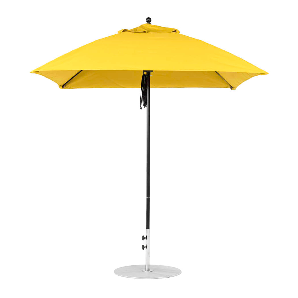 The Ledge Lounger Essential Fiberglass Umbrella - 7.5 Square Pulley features a yellow marine-grade fabric canopy with a silver pole and round base, providing vibrant shade and durability for outdoor settings.