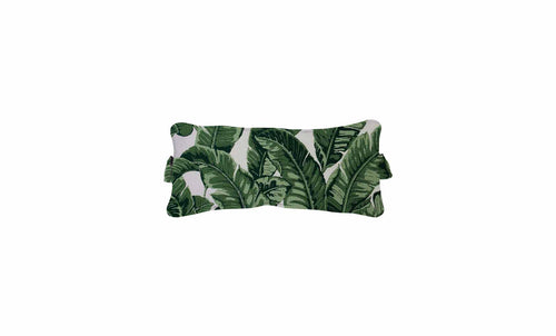 The Signature Headrest Pillow by Ledge Lounger features a rectangular design with tropical banana leaf patterns. Lush green leaves contrast beautifully against a white background, perfect for in-pool relaxation or customized comfort.