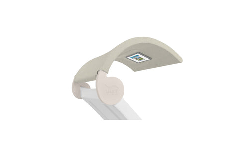 The Signature Chaise Shade by Ledge Lounger is a beige, curved desk light with a flexible neck and integrated LED display for custom positioning. Its rounded base is branded Ledge Lounger, adding style and functionality to any relaxation or work space.